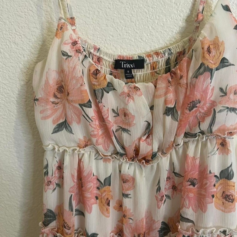 Floral babydoll dress with adjustable straps and ruffles